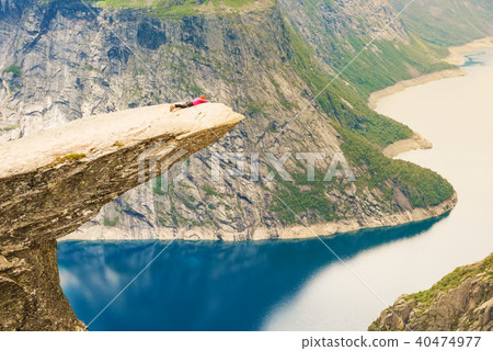 Sporty woman posing on Trolltunga Norway Sporty woman posing on Trolltunga Norway 40474977