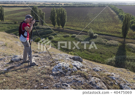 Nature photographer with digital camera. Nature photographer with digital camera. 40475069