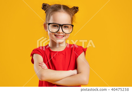 funny child girl in glasses on colored background 40475238