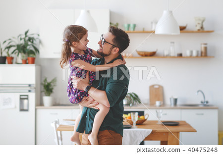 Father's day. Happy family daughter hugs his dad Father's day. Happy family daughter hugs his dad 40475248