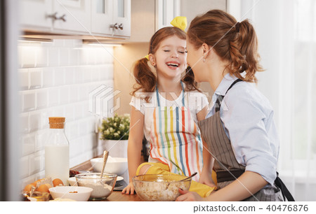 happy family in kitchen. mother and child baking cookies happy family in kitchen. mother and child baking cookies 40476876