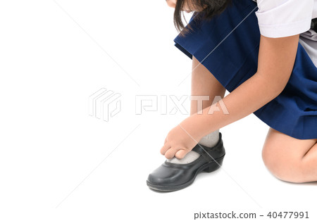 asian kid girl lacing student shoes isolated asian kid girl lacing student shoes isolated 40477991