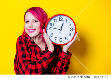 Young redhead girl with big clock Young redhead girl with big clock 40479136