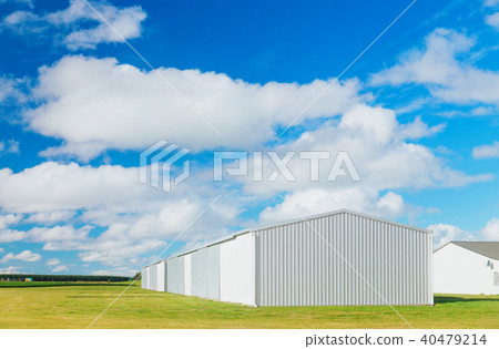 Metallic warehouse with blue sky Metallic warehouse with blue sky 40479214