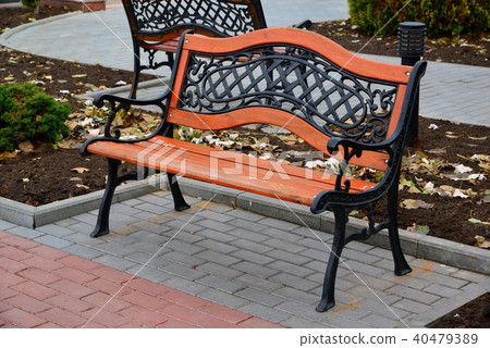wooden benches with metal back in park wooden benches with metal back in park 40479389