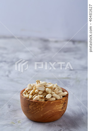 Pile of peelled peanuts isolated on white textured background, background, top view, close-up Pile of peelled peanuts isolated on white textured background, background, top view, close-up 40481627