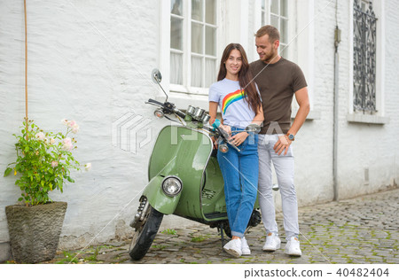 Image of young happy loving couple holding map  40482404