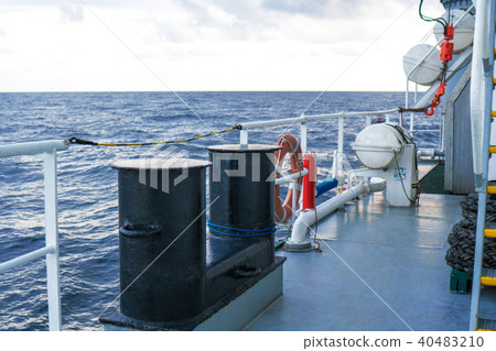 View of ocean from ship or vessel. LSA life saving equipment is on deck View of ocean from ship or vessel. LSA life saving equipment is on deck 40483210