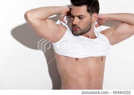 Cute guy is posing meditatively Cute guy is posing meditatively 40484202