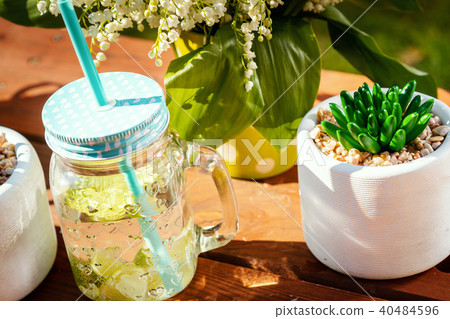 glass of delicious lemonade on a picnic table glass of delicious lemonade on a picnic table 40484596
