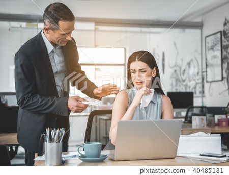 Outgoing boss soothing sad employee Outgoing boss soothing sad employee 40485181