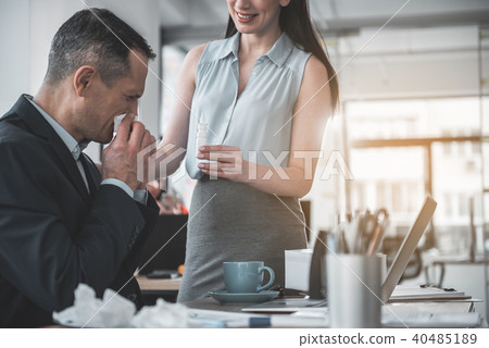 Happy lady presenting medicine for partner 40485189