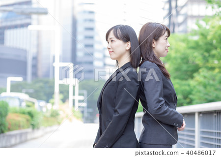 Two women in suits Two women in suits 40486017