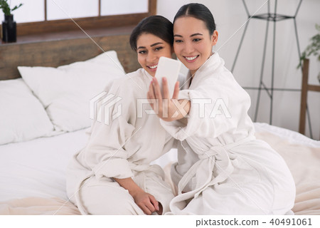 Positive attractive women taking a selfie 40491061