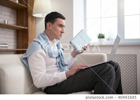 Nervous anxious man distracting from reading Nervous anxious man distracting from reading 40491685