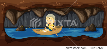 A Kid Riding a Boat in the River Cave 40492683