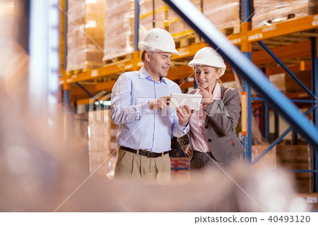 Positive business partners looking at the tablet screen 40493120