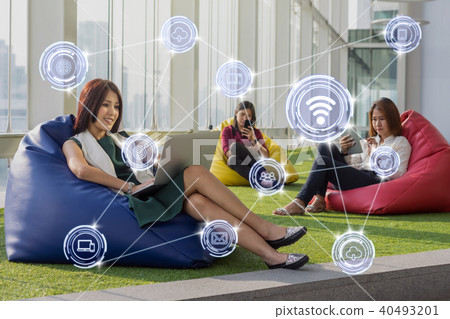 Wireless communication connecting of smart city Internet of Things Technology over three women using social network each technology equipment In the modern creative Office, business IOT concept Wireless communication connecting of smart city Internet of Things Technology over three women using social network each technology equipment In the modern creative Office, business IOT concept 40493201