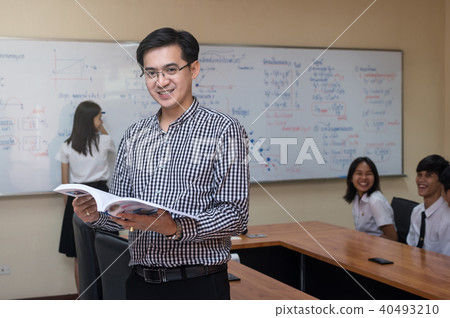 Portrait of Asian teacher in front of College Students in the classroom, University education concept 40493210
