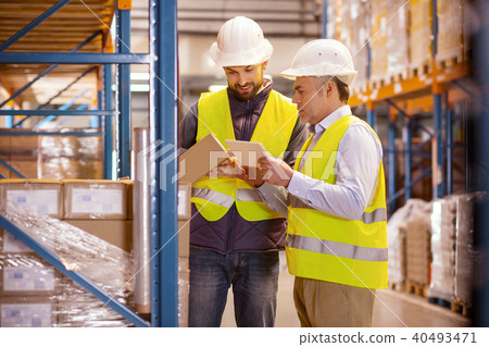 Delighted nice man holding a box 40493471