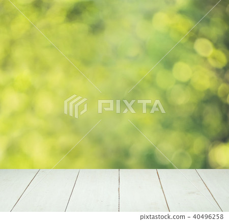 Abstract Green Bokeh and White Wooden Board Abstract Green Bokeh and White Wooden Board 40496258