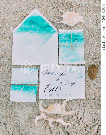 The above view of the composition consisted of the painted letters lying on the sand near the shells 40498398