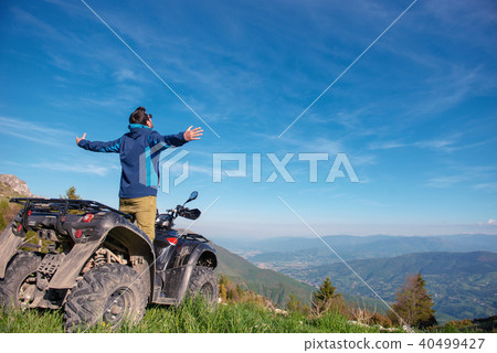 Man on the ATV Quad Bike on the mountains road. 40499427