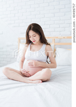 pregnant women on the bed pregnant women on the bed 40499757