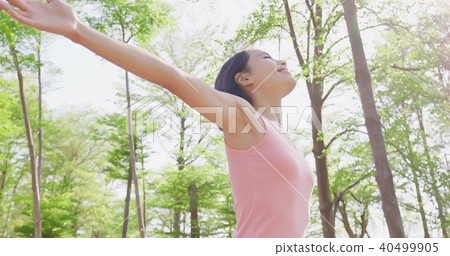 woman feel free in forest 40499905