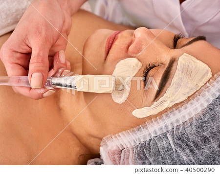 Collagen face mask. Facial skin treatment. Woman receiving cosmetic procedure. Collagen face mask. Facial skin treatment. Woman receiving cosmetic procedure. 40500290