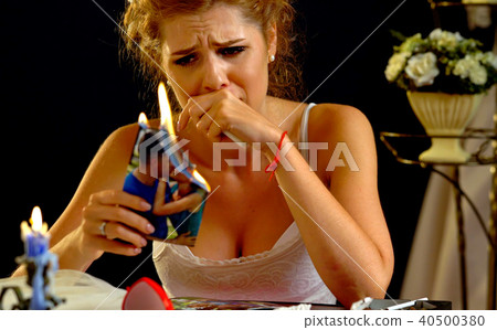 Broken heart woman. Couple break up. Burning family photo. 40500380