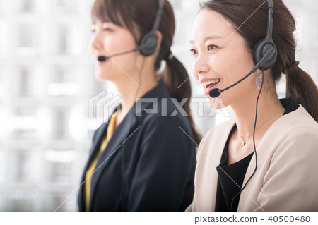 Two women at call center operator 40500480