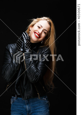 Photo of smiling blonde in leather jacket Photo of smiling blonde in leather jacket 40500671
