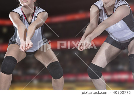 Female professional volleyball player on volleyball court Female professional volleyball player on volleyball court 40500775