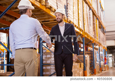 Positive joyful men greeting each other Positive joyful men greeting each other 40500806