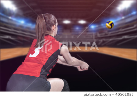 Female professional volleyball player on volleyball court 40501085