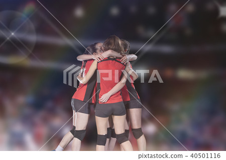 Woman volleyball Players celebrating victory and gold medal 40501116