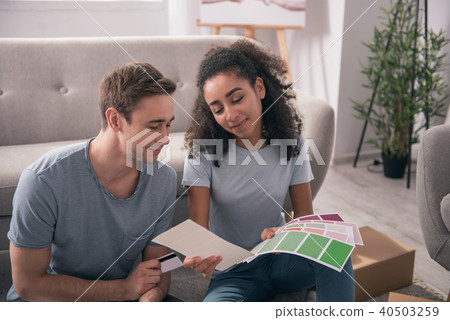 Joyful young couple looking at the colors 40503259