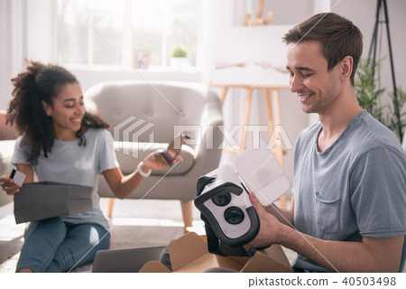 Joyful pleasant man holding 3d glasses Joyful pleasant man holding 3d glasses 40503498