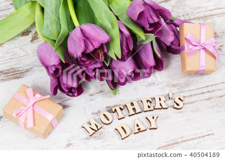 Purple tulips and gifts for mother's day on boards Purple tulips and gifts for mother's day on boards 40504189