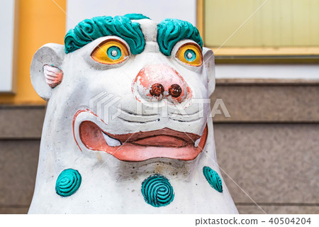 Beautiful painted singha statue close 40504204