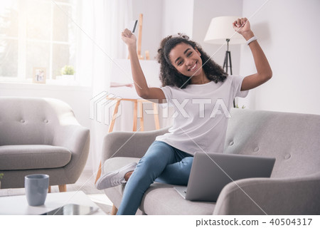 Pleasant young student showing her emotions 40504317