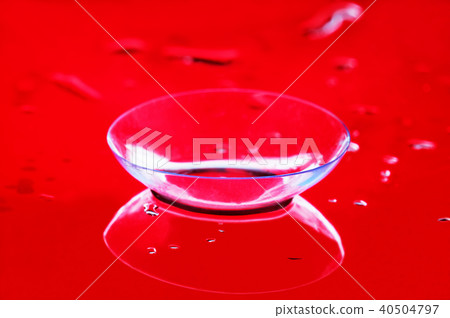 One contact lens lie on a mirror surface One contact lens lie on a mirror surface 40504797