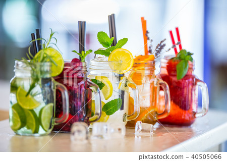 Various lemonades in mason jars and fresh fruit. Various lemonades in mason jars and fresh fruit. 40505066