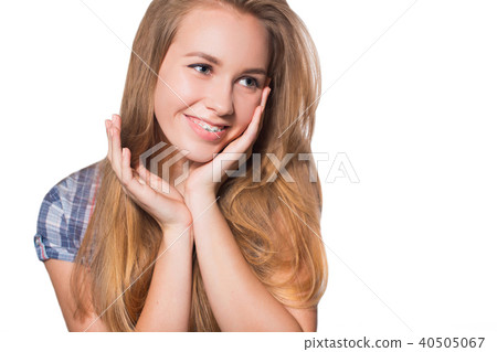 Portrait of teen girl showing dental braces. 40505067