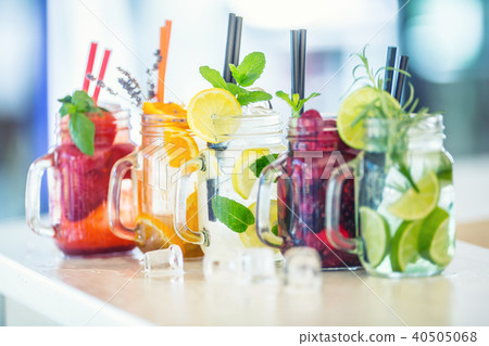 Various lemonades in mason jars and fresh fruit. Various lemonades in mason jars and fresh fruit. 40505068