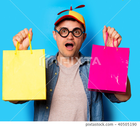 nerd man with noob hat holding a shopping bags 40505190