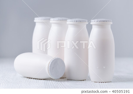drink yogurt in plastic bottles on gray background drink yogurt in plastic bottles on gray background 40505191