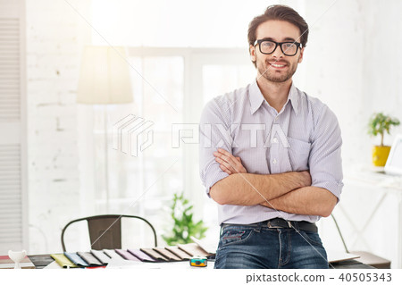 Happy businessman standing near the table Happy businessman standing near the table 40505343