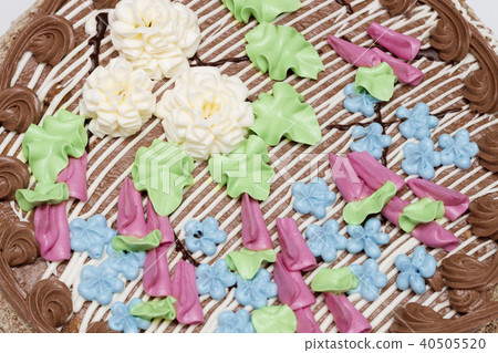 Cake with cream, nuts and meringue. Top view 40505520